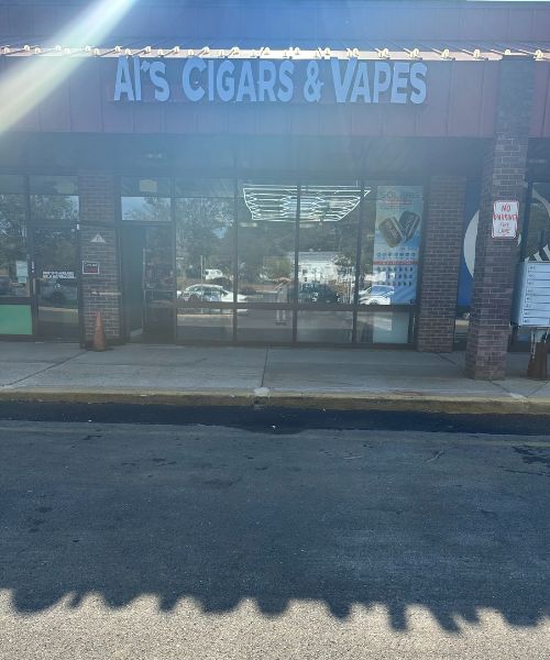 The front of a cigar and vapes store