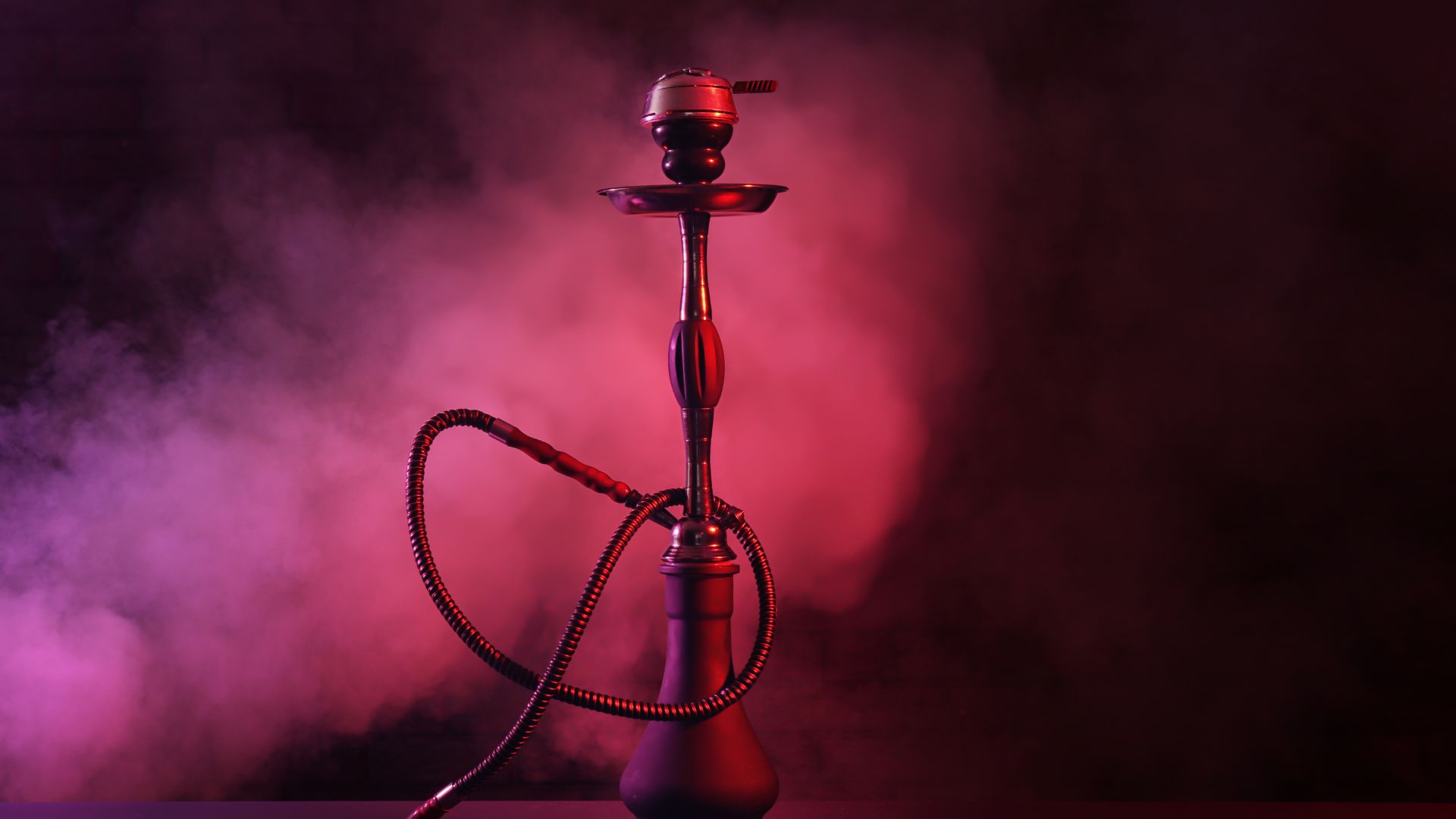 A hookah pipe with smoke coming out of it